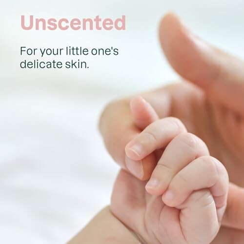 Adult hand holding a baby's hand with text 'Unscented for your little one's delicate skin.'